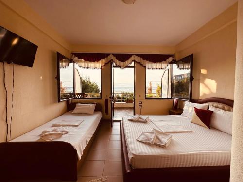 Postel nebo postele na pokoji v ubytování Hotel Saint Marena