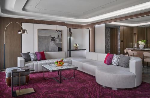 a living room with a couch and a table at InterContinental Shenzhen WECC by IHG in Shenzhen
