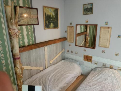 a bedroom with two beds in a room at Apollo pokój 4 osobowy Szklary-Huta26 in Ząbkowice Śląskie