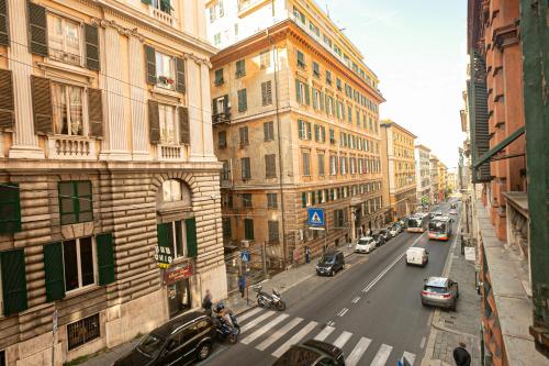a view of a city street with cars and buildings at Dimora patrizia in centro in Genova