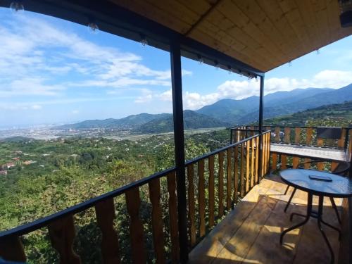a balcony with a table and a view at chemi kera Chalet in Makho