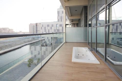 a large building with a bath tub on the floor at Luxury Duplex In Raha Lofts in Abu Dhabi