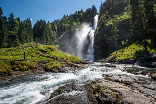 a waterfall in the middle of a river at Nikye Morillon 5 personnes in Morillon