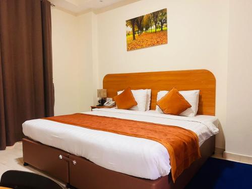 Postel nebo postele na pokoji v ubytování Marhaba Deira Hotel