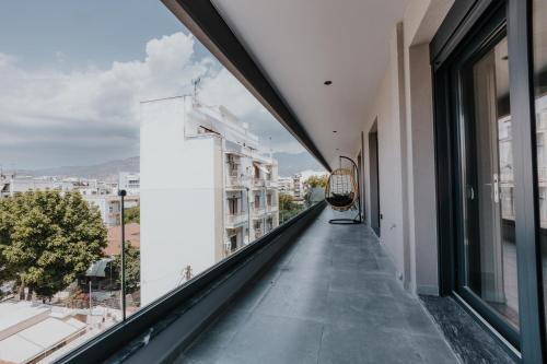 a balcony with a view of a city at Pearl Apartel in Volos