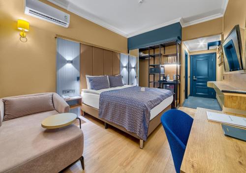 Postel nebo postele na pokoji v ubytování Numa Port Hotel
