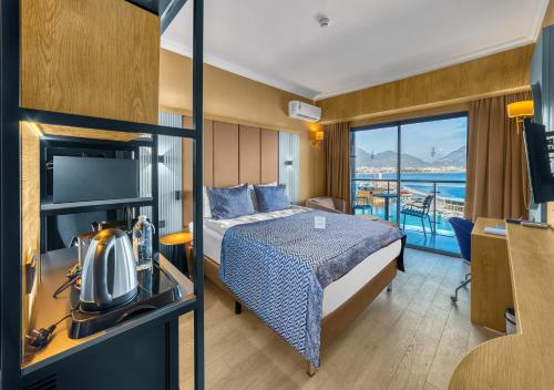 Postel nebo postele na pokoji v ubytování Numa Port Hotel