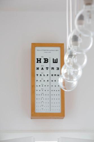 a calendar on a wall with lights on it at Casa Tesor - your design home in Mantua city center in Mantova