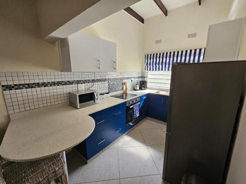 Η κουζίνα ή μικρή κουζίνα στο 14 Manzini Chalets -Flamingo Cove