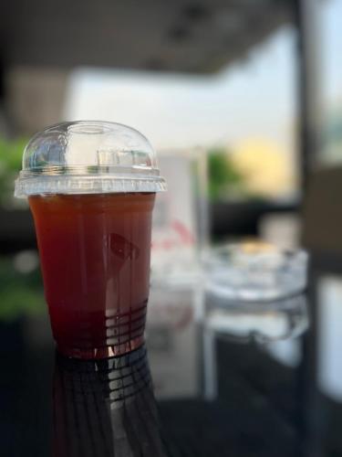 a cup of tea sitting on top of a table at فندق بلاتينيوم الفندقية Platinum Hotel in Al Madinah