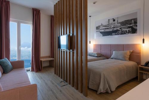 Postel nebo postele na pokoji v ubytování Horta Bay