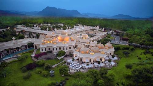 an aerial view of a large white building with domes at The Oberoi Udaivilas Udaipur in Udaipur