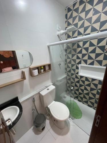 a small bathroom with a toilet and a sink at AP1 Atrás da passarela do caranguejo - Orla de Atalaia in Aracaju