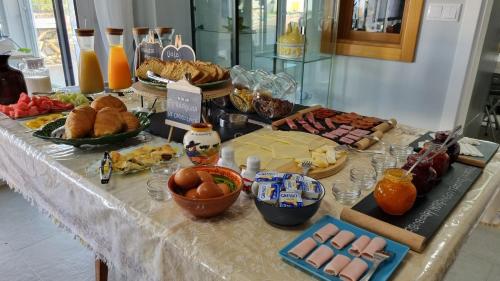 a buffet of food on a table with food at Herdade Monte Novo Do Pocinho in Cercal