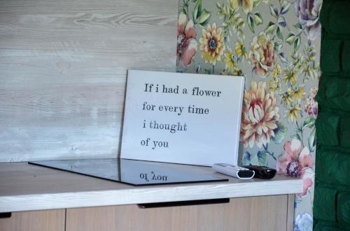 a sign sitting on top of a counter with at Hotel resort Sedula in Skogalis