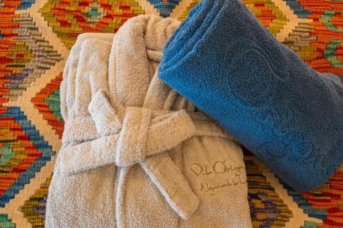 a towel sitting on top of a rug at Vila Origens Boutique Hotel Albufeira – Adults Only in Albufeira