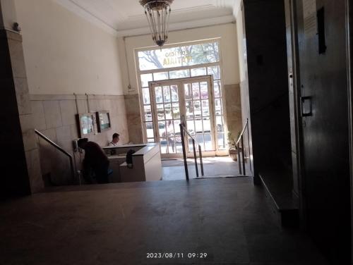 a room with a kitchen with a large window at Aconchego do Lar Centro BH Apto 633 Rua da Bahia 187 in Belo Horizonte