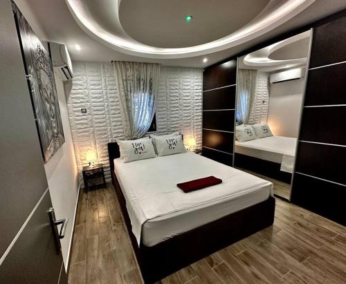 a bedroom with a large white bed in a room at Sevi House Suite in Thessaloniki