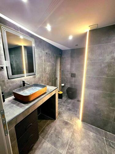 a bathroom with a sink and a toilet at Sevi House Suite in Thessaloniki