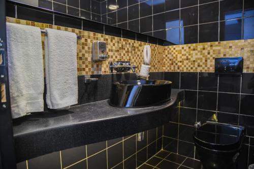 a bathroom with a sink and a toilet at Grand S Hotel in Istanbul