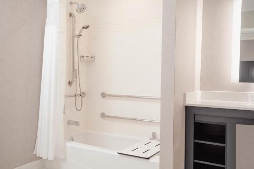 a bathroom with a shower and a sink at Residence Inn by Marriott Loma Linda Redlands in Redlands