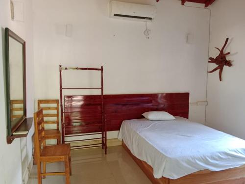 Säng eller sängar i ett rum på Sigiri Access Villa & Restaurant
