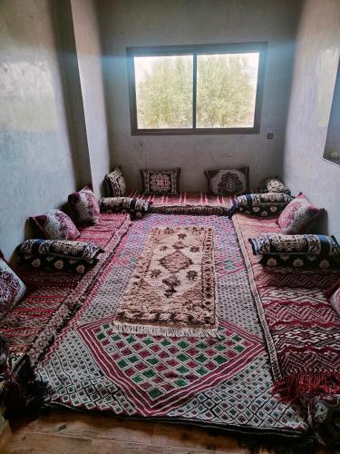 a room with a large rug on the floor at La Novia Marrakech in Tahannout