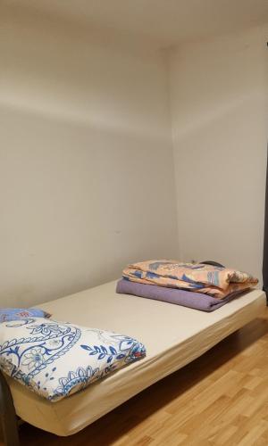 two beds in a room with white walls at Apartment free WiFi in Breitenau am Hochlantsch