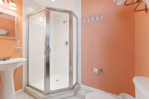 a bathroom with a shower and a sink at Nw Vacation Rental Condo W Pool & Ocean Views in North Wildwood