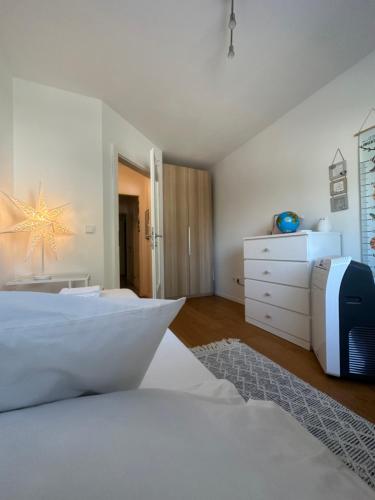 Un pat sau paturi într-o cameră la Appartement Lena