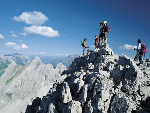 a group of people standing on top of a mountain at Bacherhof in Sankt Anton am Arlberg