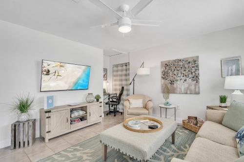 a living room with a couch and a table at Beautiful Updated 2Bedroom Suite minutes to Downtown, Amazing Beaches, Restaurants, Theaters and MORE in Sarasota