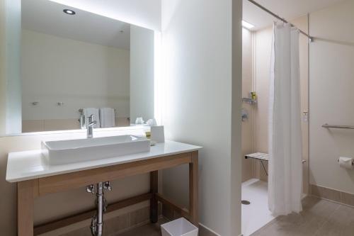 a bathroom with a sink and a shower at Element St. Louis Midtown in Saint Louis