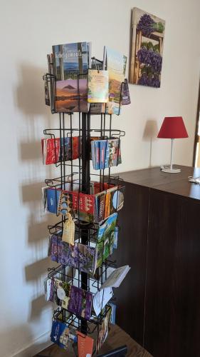 a book rack filled with books on a wall at Gîte de campagne Clos Beau Soleil in Caumont-sur-Durance