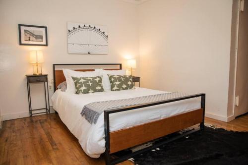 a bedroom with a large bed with two lamps at Studio Apt in Time Square! in New York