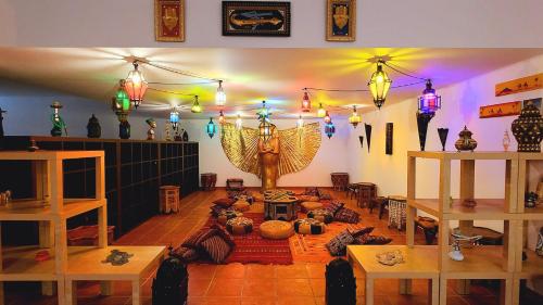 a room with a room with a table and lights at VILLA ALTUS near Ericeira with swimming pool, jacuzzi and 2 games room in Cambaia