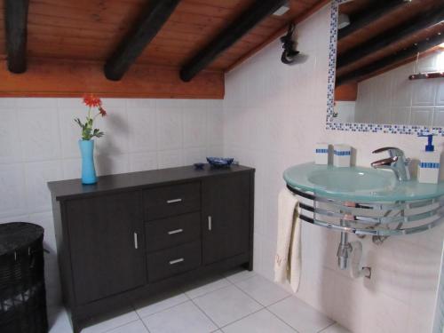 a bathroom with a sink and a counter at My House - Casa Charme in Monchique