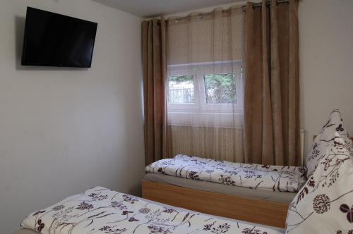 מיטה או מיטות בחדר ב-Penzion Levandule