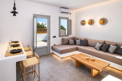 a living room with a couch and a table at Anatelo house in Fira