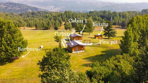 an aerial view of a house in a field at Vikendice Gornja Brezna - Mountain cabin Gornja Brezna in Pluzine