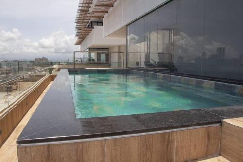 a large swimming pool on top of a building at Brand new, with private Jacuzzi in Carlos Guerra