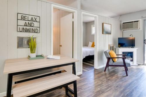 a living room with a desk and a bedroom at Kimberling City Oasis Boat Slip, Kayaks and More! in Kimberling City