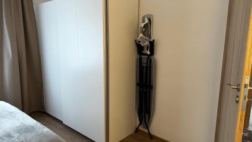 a door with a gun hanging on the wall at Japandi apartamentai in Kaunas