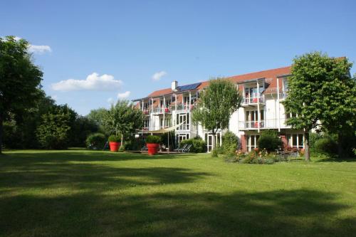 a large building with a large lawn in front of it at AngerResidenz in Zwiesel