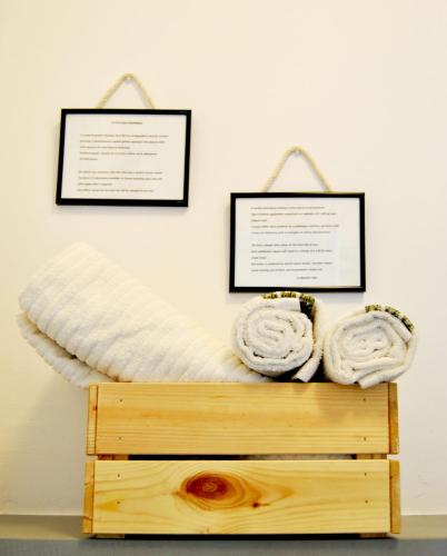 a bed with two towels on top of a wooden platform at Le Bassotte b&b in Perugia