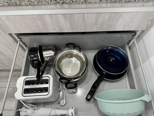 a kitchen drawer with various kitchen utensils in it at CG4N - Nuevo Estudio, recién reformado, Wifi in Torremolinos