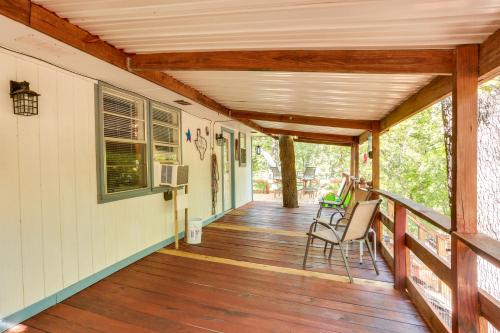 a porch of a house with a wooden deck at Dog-Friendly Kingston Cabin with Wraparound Deck! in Kingston