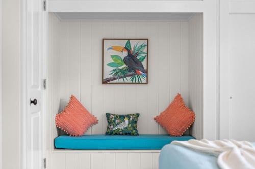 a room with two pillows and a bird on the wall at Heated Salt Pool, Arcade, 2 Kings, Near Ami, Img in Bradenton