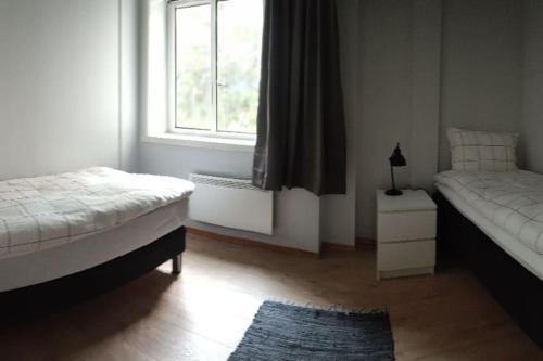 Letto o letti in una camera di Tromso Downtown Apartments - Main Street