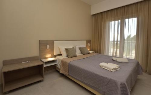 Katil atau katil-katil dalam bilik di Flisvos Rooms